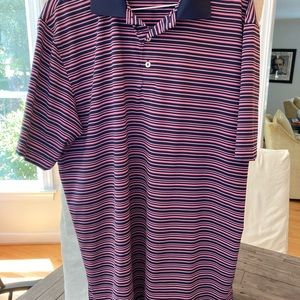 Peter Millar performance fabric men’s golf shirt in navy/pink stripe, size L.